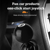 A close-up of a black billiard ball style car start joystick with a lucky number sticker installed.