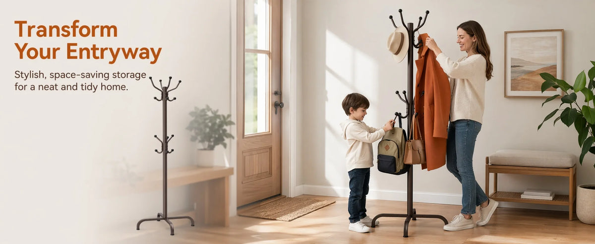 A woman hangs an orange coat on a black metal coat rack in a bright entryway.