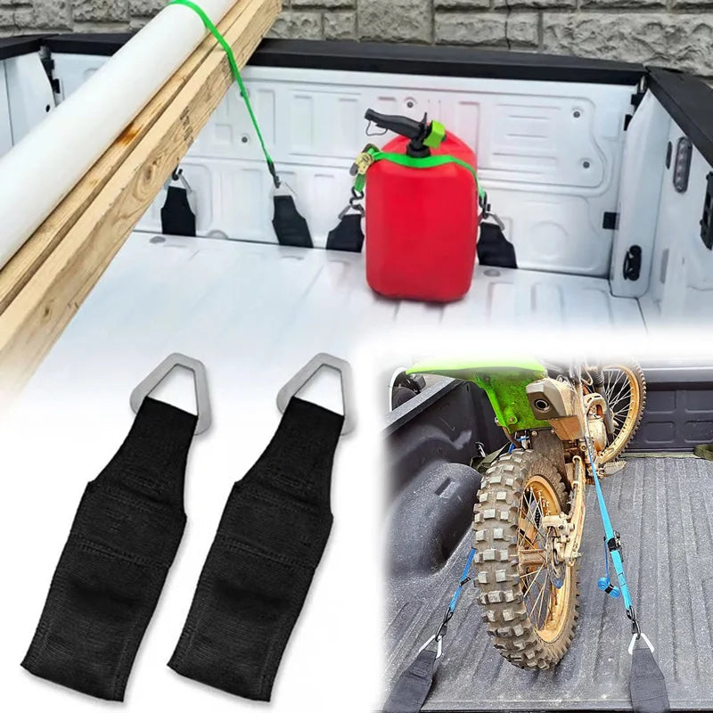 Two black EZ Bed Anchor no-drill tie-down straps are shown with a red anchor and a tire mounted on a truck tailgate.