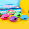 Colorful silicone mermaid shell squeeze toys in pink, green, purple, and blue are displayed next to their packaging.
