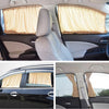 Interior view of a car showing a beige fabric sun shade covering the side windows.