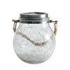 A clear crackle glass solar lantern with a metal top and wooden handles, emitting a warm ambient glow.