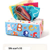 A box of silk scarves featuring cartoon animals like a pink lamb, brown bear, orange cat, and blue elephant.