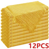 A stack of ten golden yellow raw-edge polyester cloth napkins.