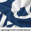 A navy blue and white patterned fleece blanket draped softly.