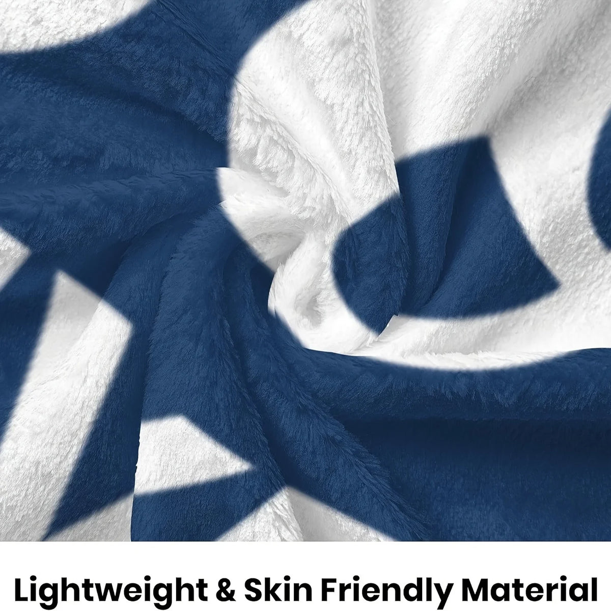 A navy blue and white patterned fleece blanket draped softly.