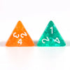 Two triangular crystal dice, one orange and one green, are displayed on a white surface.