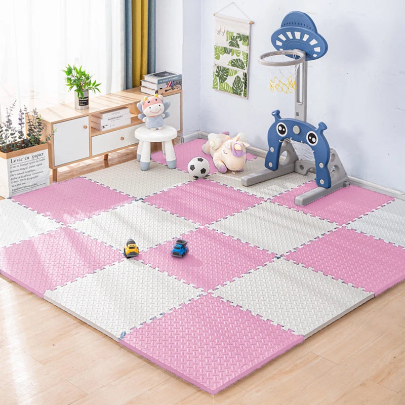 An interlocking foam play mat with various toys and a climbing arch for babies and toddlers.