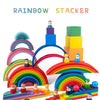 A colorful wooden rainbow stacker set featuring various colored blocks and arches for creative building.