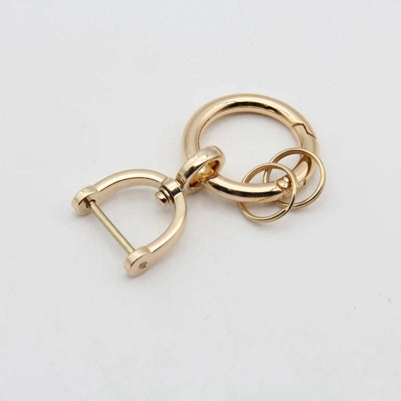 Gold-toned soft TPU car key fob cover for a Nissan 5-button key.