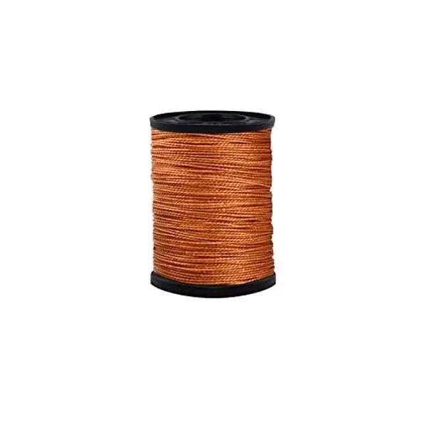 Spool of orange heavy duty nylon thread for upholstery repair