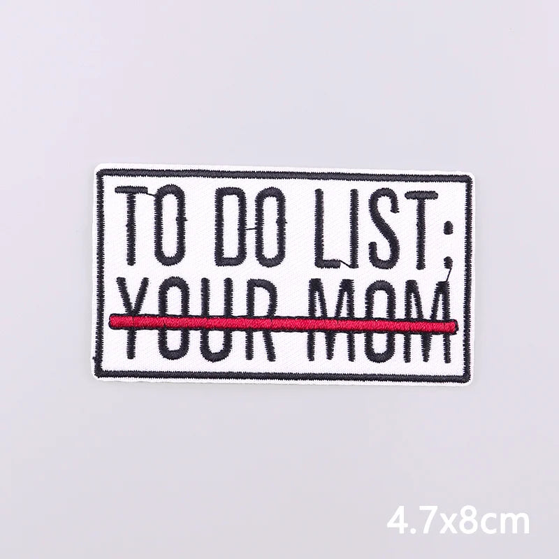 Black embroidered iron-on patch with white text TO DO LIST YOUR MOM and a red line underneath