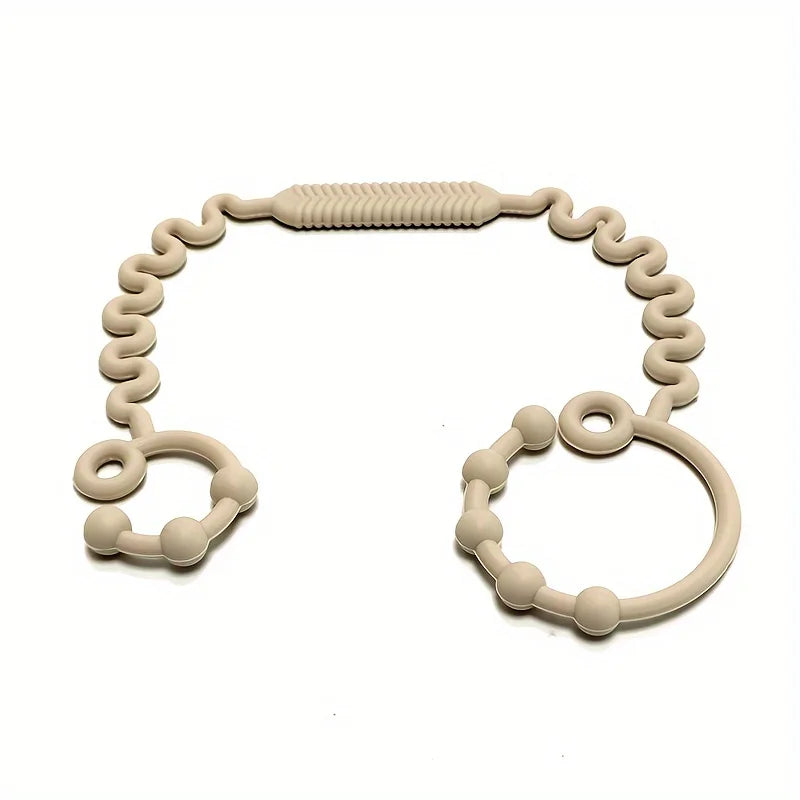 A silicone anti-drop pacifier clip with a teether, light beige color.