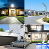 Exterior view of a modern house featuring high-powered solar flood lights and motion sensors.