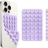 A white smartphone case and a purple suction cup phone mount with multiple circular pads for hands-free use.