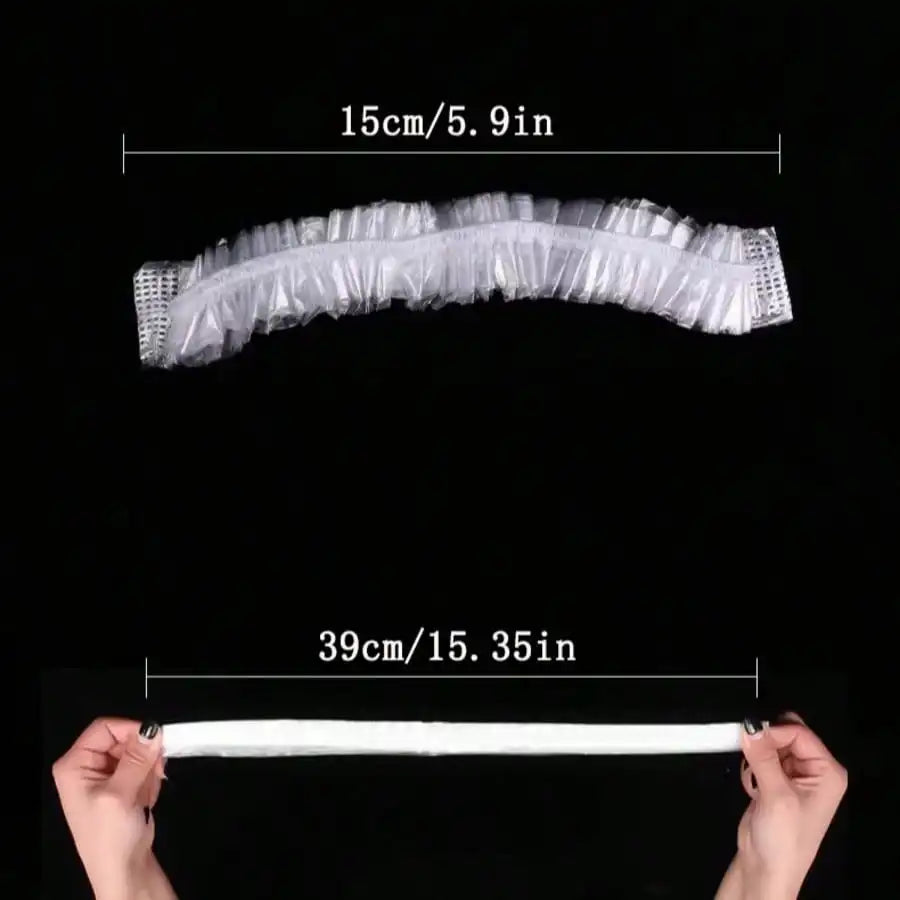 A transparent plastic shower cap is shown, measuring 15cm or 5.9 inches.