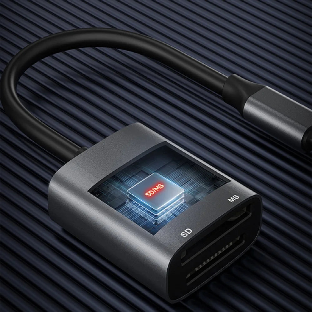 A close-up view of a gray dual-slot card reader with a black cable, featuring an SD card slot and a micro SD slot.