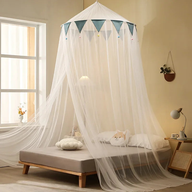 A romantic canopy mosquito net draped over a bed, featuring sheer white fabric and triangular accents.
