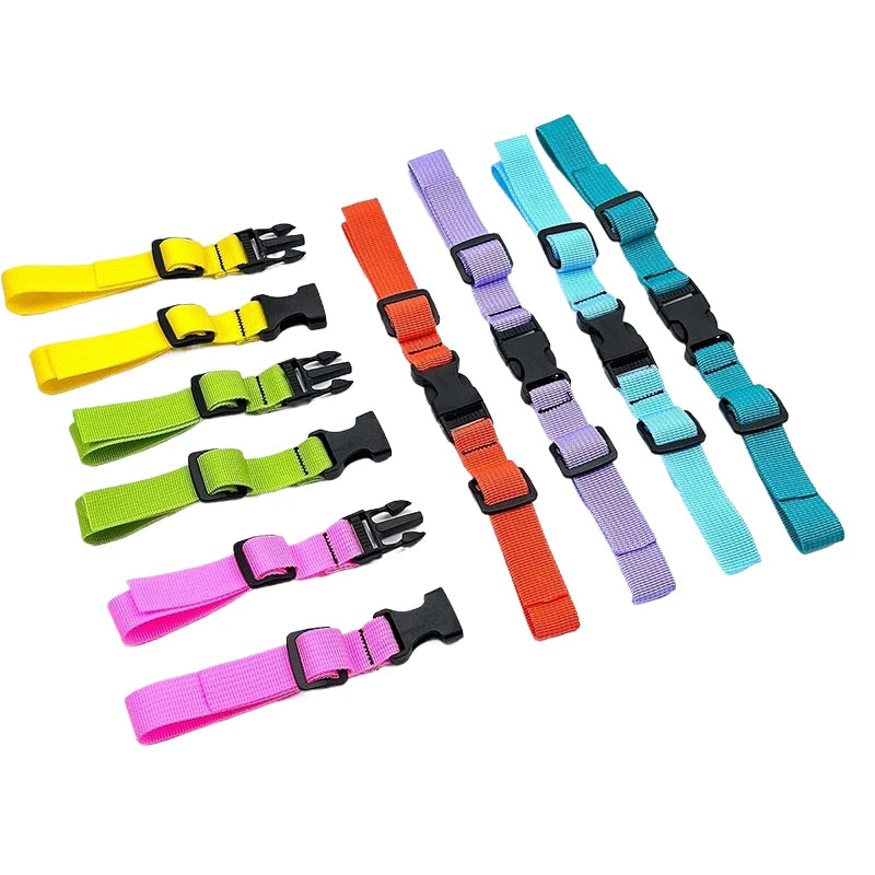 A collection of colorful adjustable backpack chest straps in various colors like yellow, green, purple, and blue.