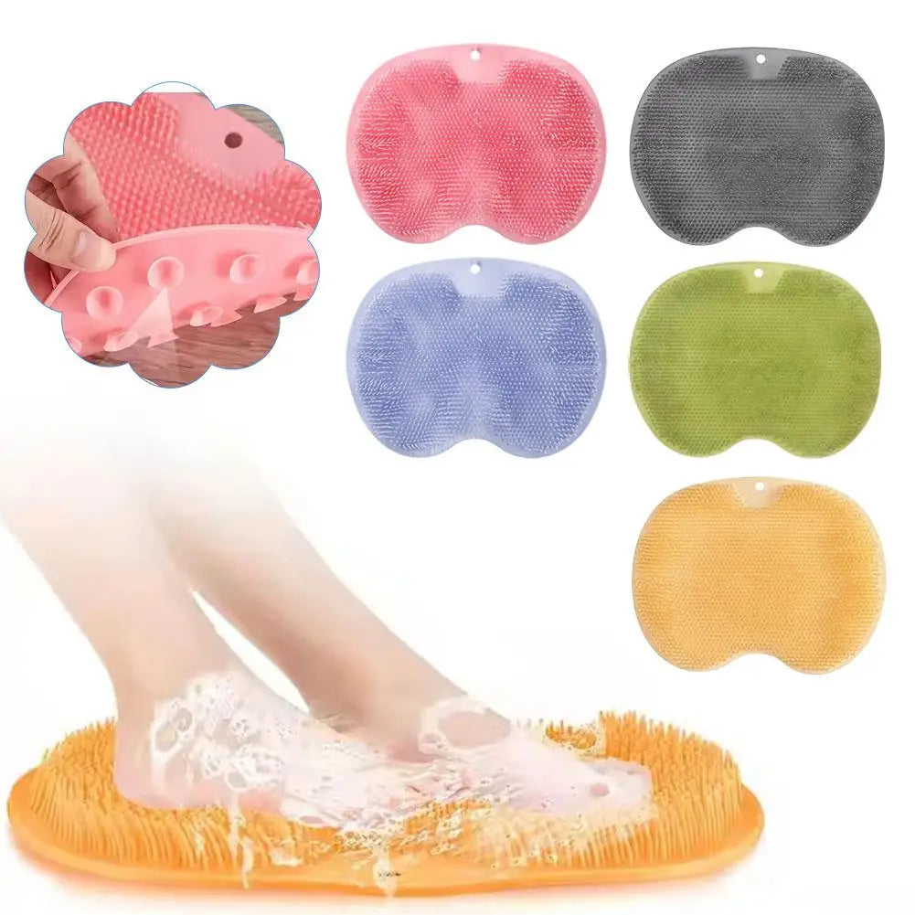 A collection of various colored ergonomic silicone foot scrubbers and a yellow suction base for foot exfoliation.