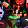 An LED fog-mist Halloween cauldron with a green potion and a skull skeleton inside.