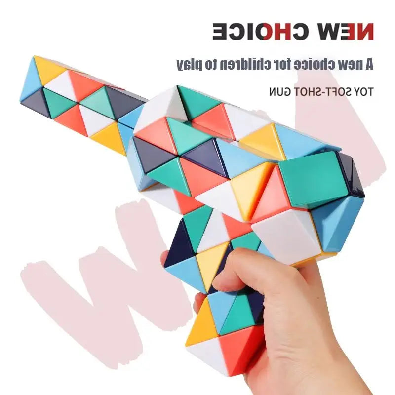 A hand is interacting with a colorful, transformable fidget puzzle toy made of geometric shapes.