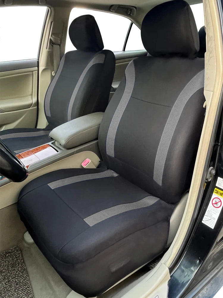 A black and gray universal two-tone car seat cover set installed in a vehicle interior.
