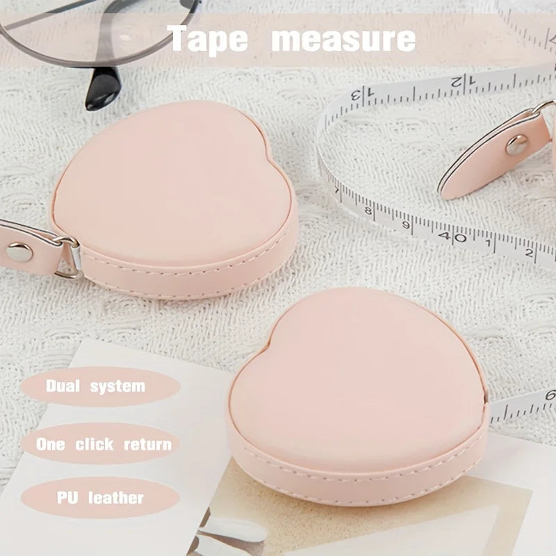 Pink PU leather tape measure with a heart-shaped case and a measuring tape visible.