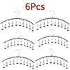 Six packs of metal pant hangers with individual clips for clothing organization