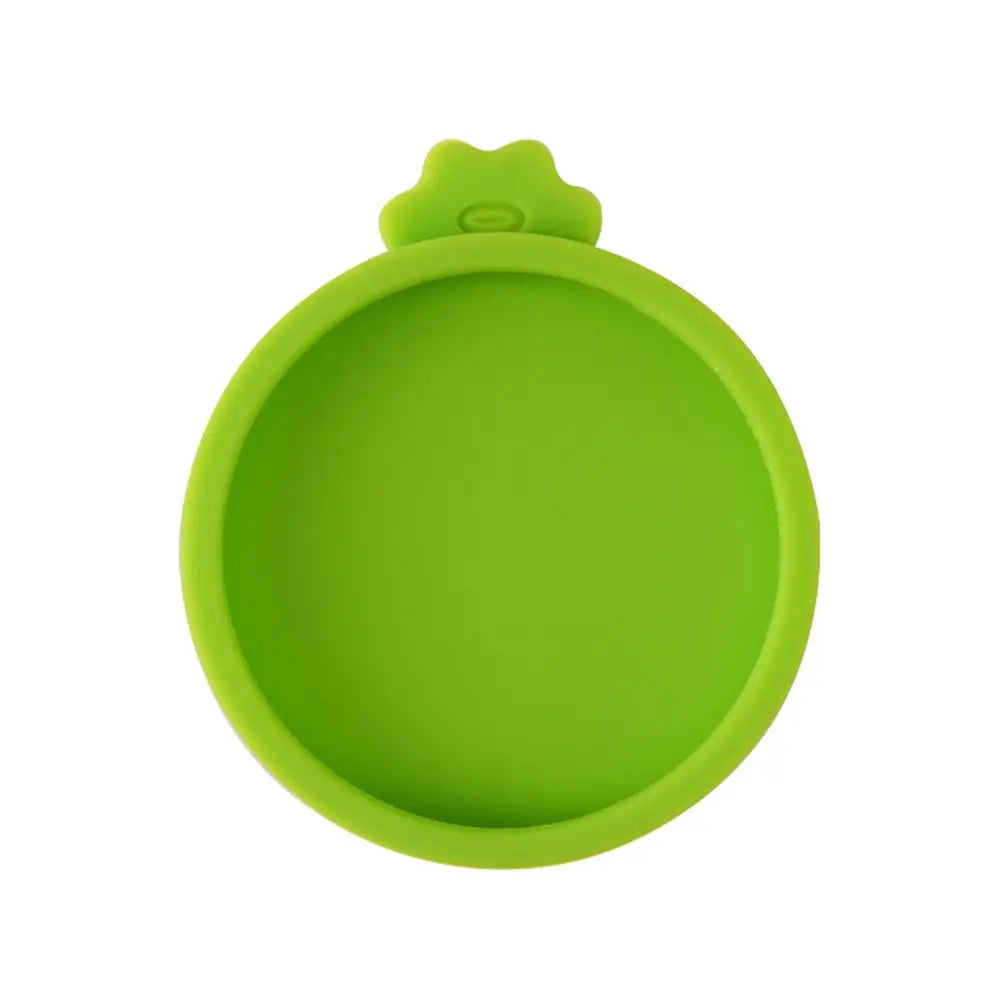 A bright lime green reusable silicone food storage lid with a rounded, slightly fluted edge.