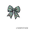 A dark olive green and brown patterned fabric bow embroidered as a hunting patch badge.