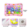 Pink inflatable ocean-themed water play mat for baby sensory development showing smooth edges, clear printing, and a leak pro