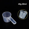 Clear plastic measuring cup with volume markings for liquid measurement