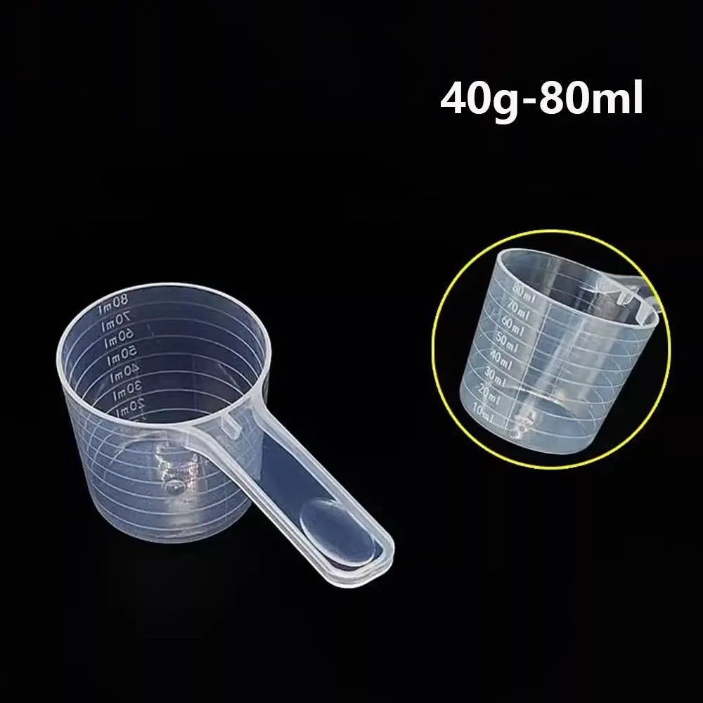 Clear plastic measuring cup with volume markings for liquid measurement