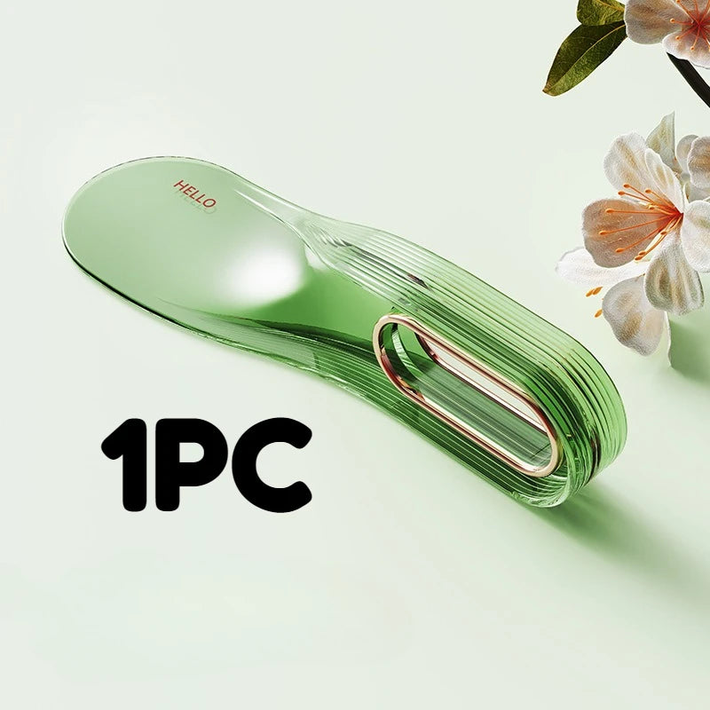 A single green mattress lifter wedge tool is shown on a light surface.