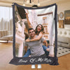 A framed photo blanket featuring a couple smiling in an outdoor setting.