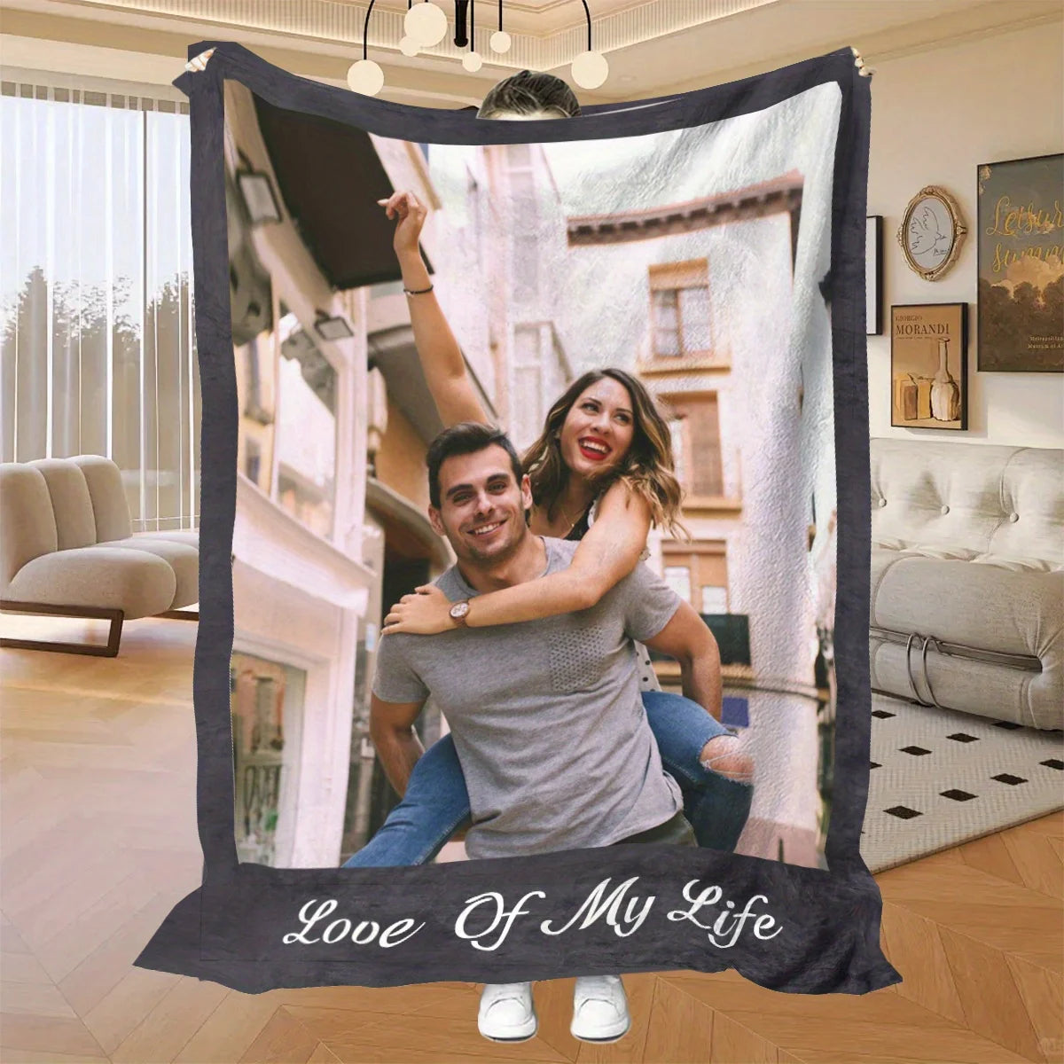A framed photo blanket featuring a couple smiling in an outdoor setting.