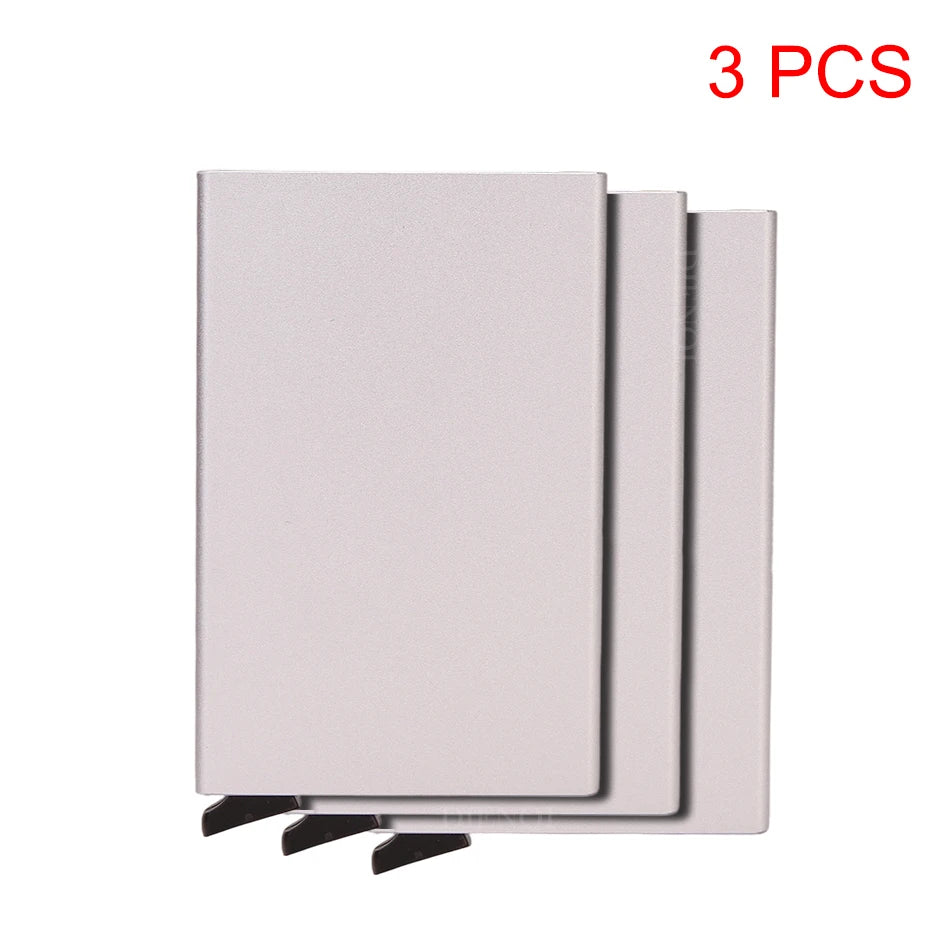 Three slim metal RFID blocking card holders with a pop-up design shown side by side.