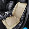 Interior view of a black car seat with a beige leather cushion and perforated fabric insert.