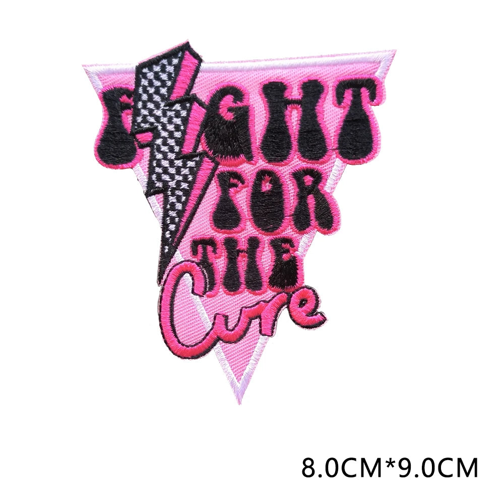 Pink embroidered patch with black lightning bolt design and text FIGHT FOR THE CURE