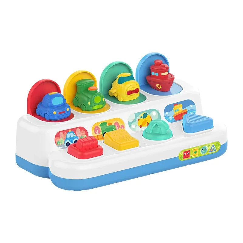A white interactive pop-up animal sensory toy featuring various colorful plastic animals like a green frog and yellow duck.