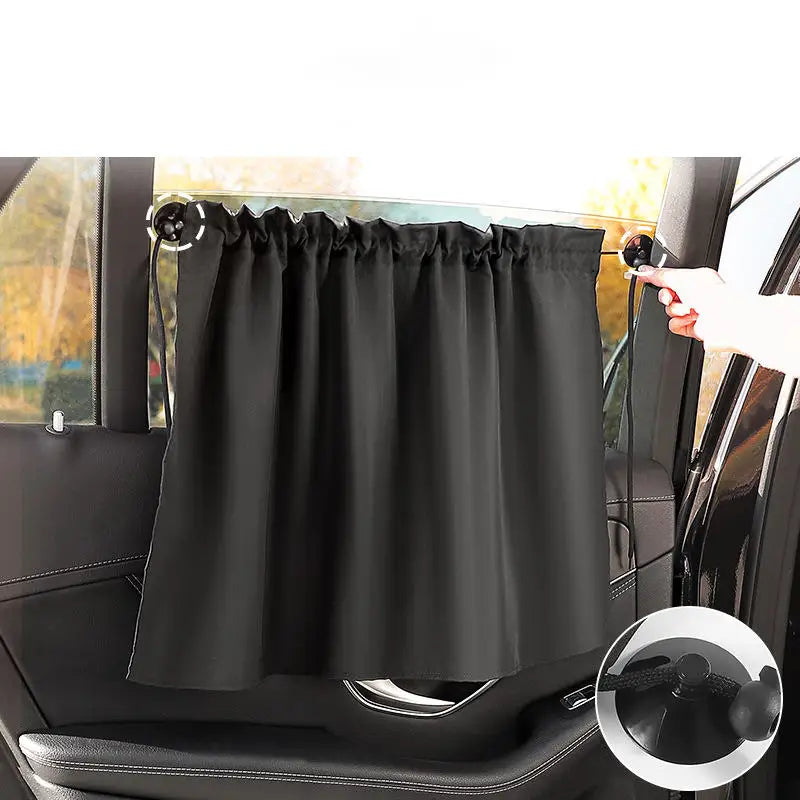 Black universal car side window sunshade installed on a vehicle window.