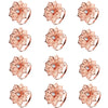 A set of twelve decorative metal napkin rings featuring a hollow-out floral pattern in a rose gold color.