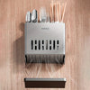 A silver cutlery organizer with a drain tray and a separate dark tray is shown against a wooden background.