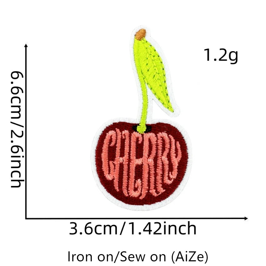 A yellow cherry embroidery patch measuring 1.2g, displayed against a scale marked in centimeters and inches.