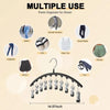 A black metal pant organizer hanger displaying various clothing items like jeans, skirts, and dress pants.