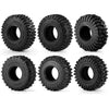 A set of four black mud terrain wheels and tires for RC crawlers.