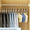 A display of metal clothespins with hooks hanging on a rod, featuring various shades of gray and blue fabric.