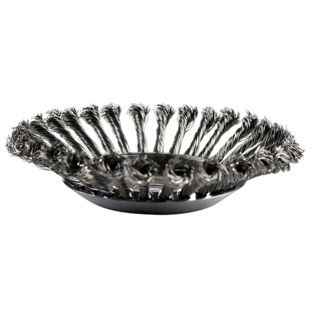 A close-up view of a black carbon steel wire trimmer head with multiple fine wires.