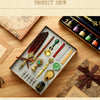 A display of a vintage calligraphy fountain pen set with various pens and a wax seal stamp kit arranged on a wooden surface.